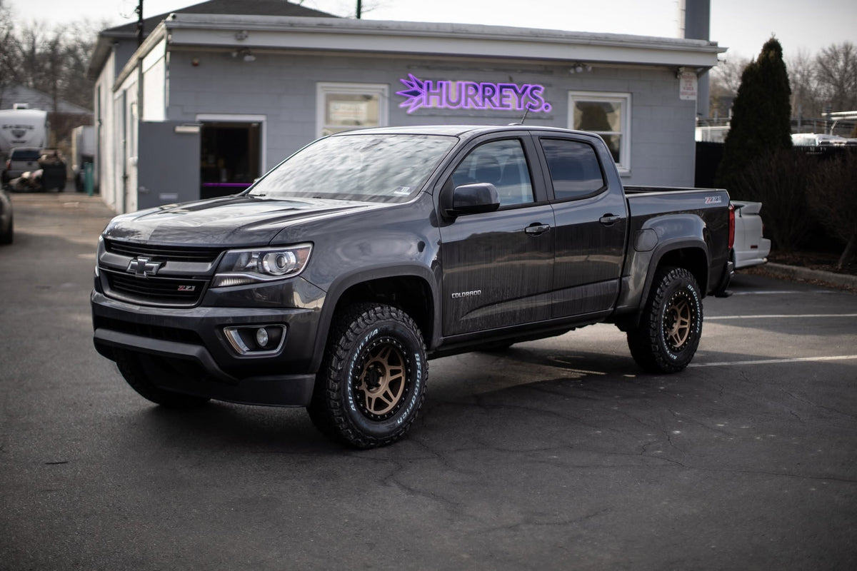 Grey Chevrolet Colorado outside the Hurrey's Performance building