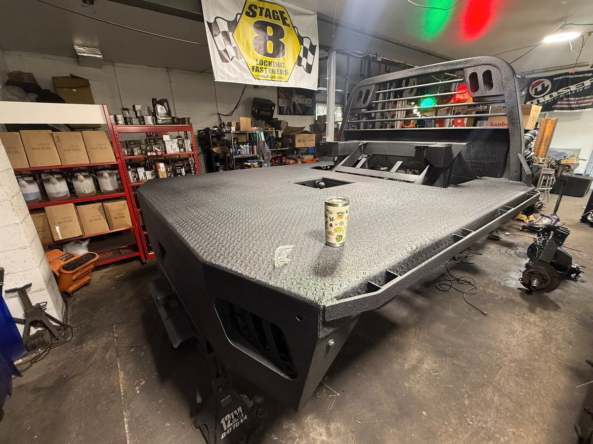 Textured black flatbed and headache rack during THE DUALLY build.