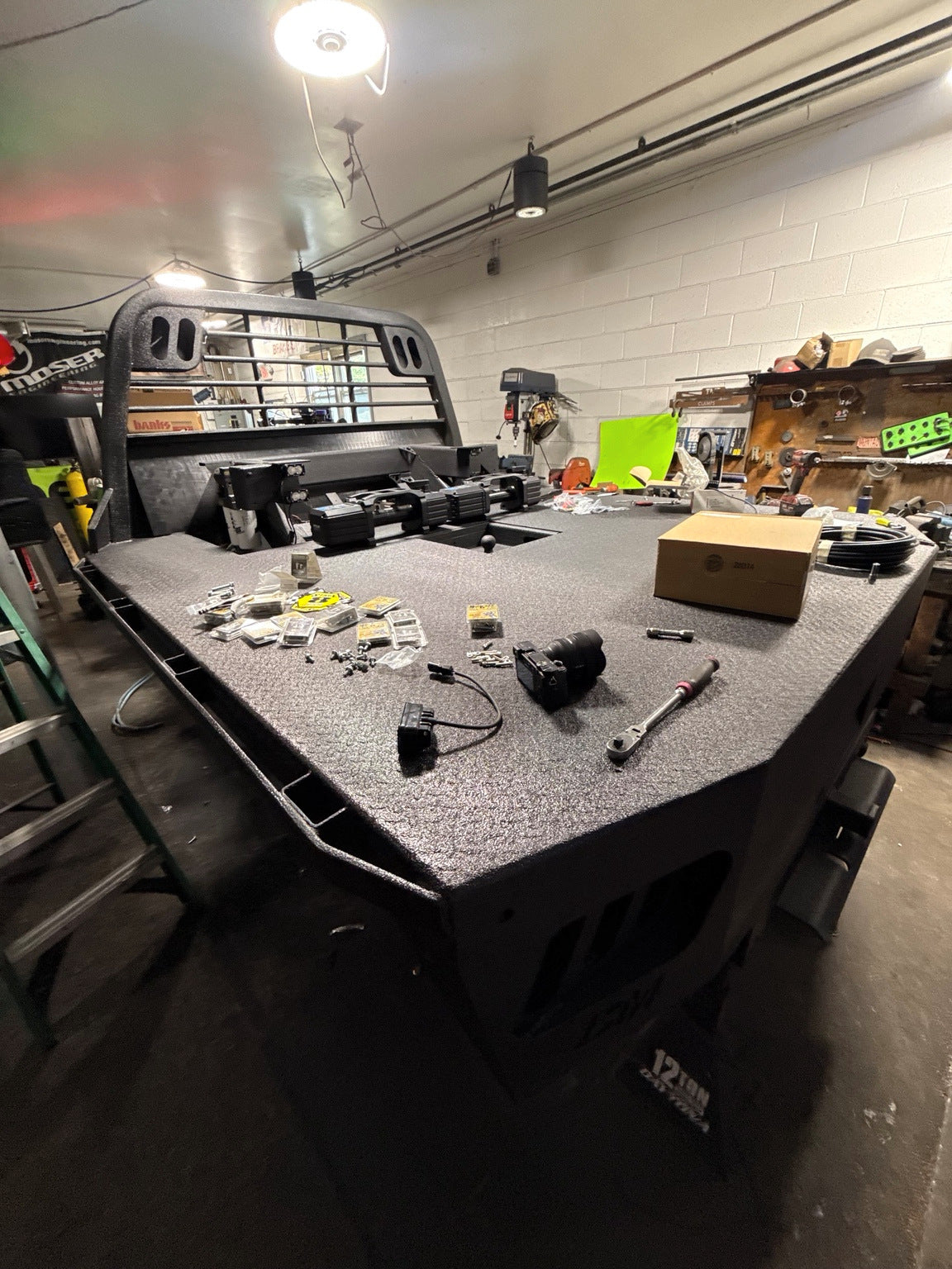 THE DUALLY coated flatbed with lighting components and installation hardware laid out.