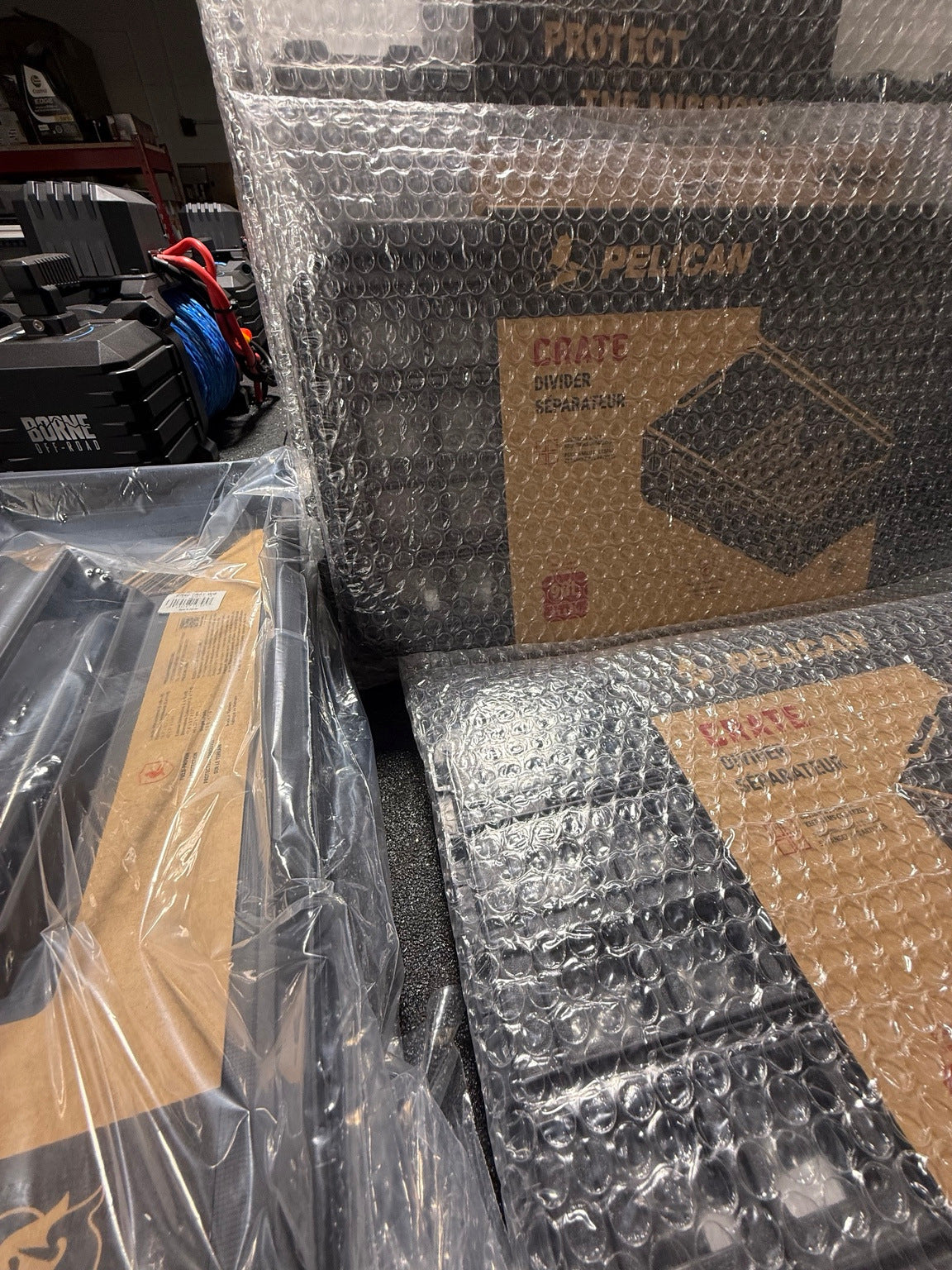 Wrapped Pelican CRATE dividers and components alongside a Borne Off-Road winch.